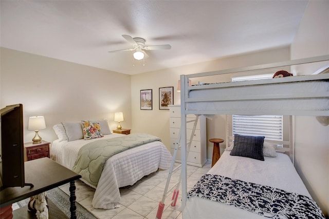 bedroom featuring a ceiling fan and light tile patterned floors