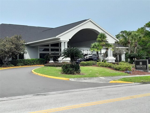 view of building exterior with driveway