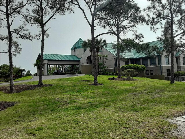 view of home's community featuring a lawn