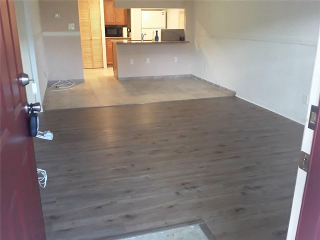 unfurnished living room featuring light wood-type flooring