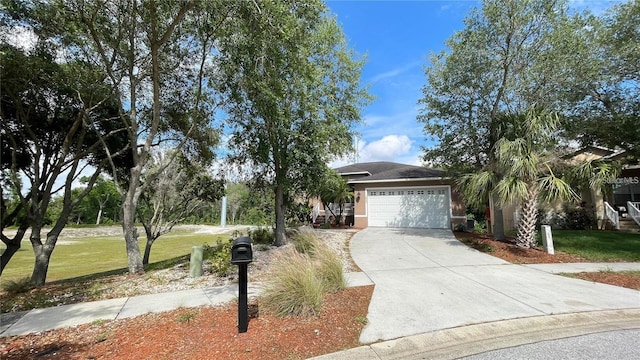 view of front of home featuring a front lawn and a garage