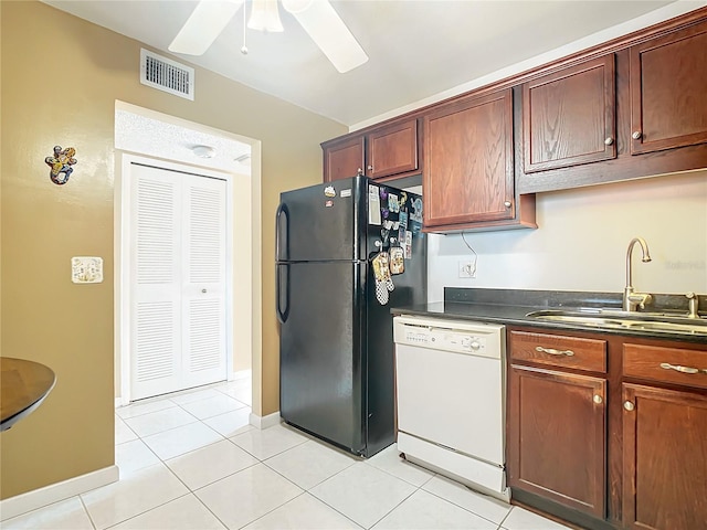 kitchen featuring black refrigerator, ceiling fan, light tile flooring, sink, and white dishwasher