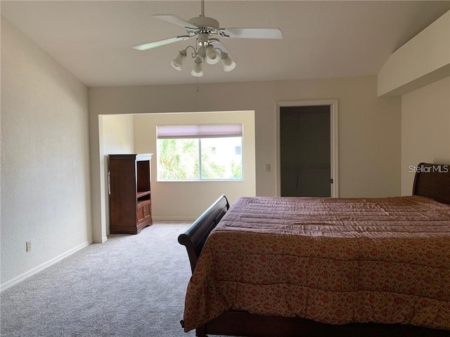 bedroom with ceiling fan and light colored carpet