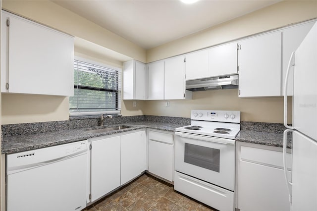 101 Lake Ave NE Unit 225, Largo, FL 33771 - kitchen featuring white appliances, under cabinet range hood, a sink, dark countertops, and white cabinets
