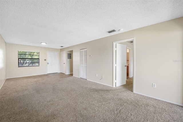 101 Lake Ave NE Unit 225, Largo, FL 33771 - carpeted spare room featuring a textured ceiling, baseboards, and visible vents