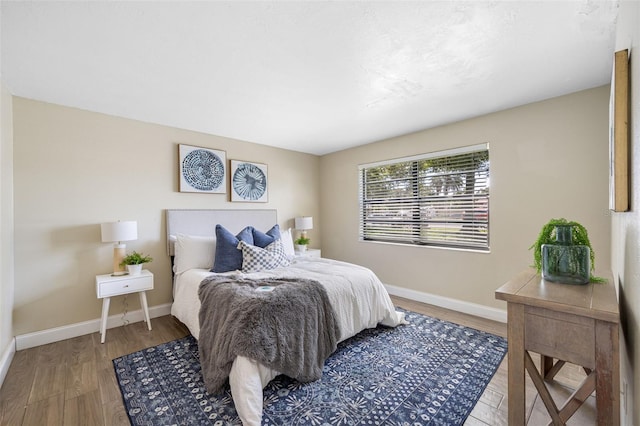 bedroom with hardwood / wood-style flooring