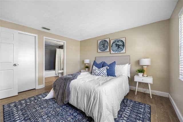 bedroom with hardwood / wood-style floors