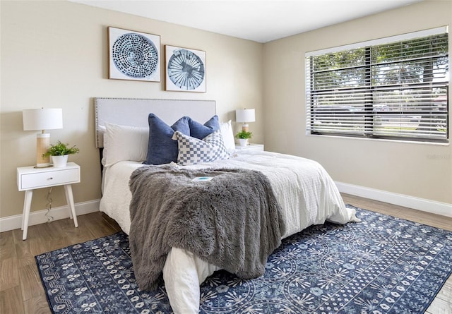 bedroom with wood-type flooring