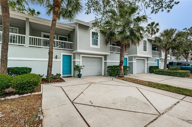 townhome / multi-family property featuring a garage