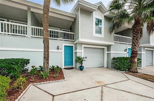 view of front facade featuring a balcony and a garage