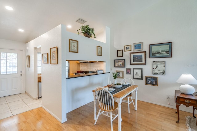 dining area with light hardwood / wood-style flooring