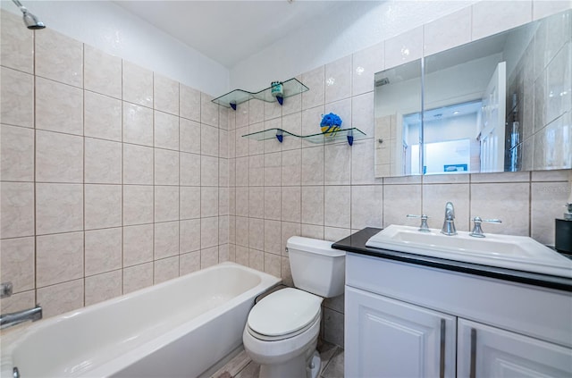 full bathroom with toilet, tile walls, tiled shower / bath, tasteful backsplash, and vanity