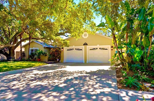 view of front of house with a front lawn and a garage