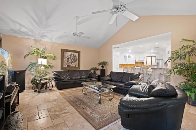 living room featuring high vaulted ceiling