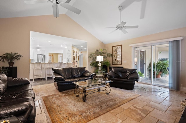 living room featuring ceiling fan and high vaulted ceiling