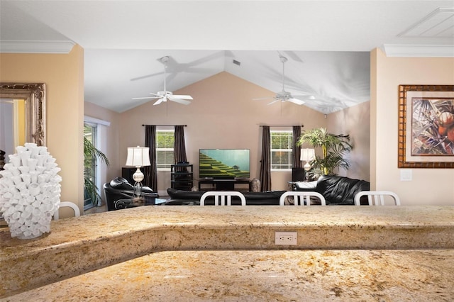 living room with vaulted ceiling, ceiling fan, a wealth of natural light, and ornamental molding