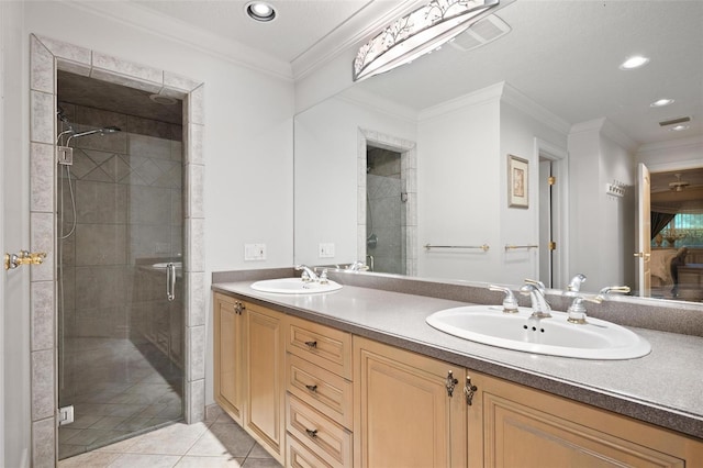 bathroom with vanity, tile patterned flooring, ornamental molding, and walk in shower