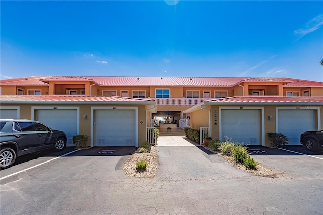 multi unit property featuring a garage