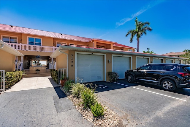 townhome / multi-family property featuring a garage and covered porch