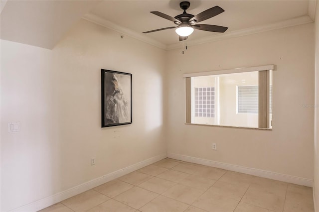 spare room featuring crown molding, ceiling fan, and light tile floors