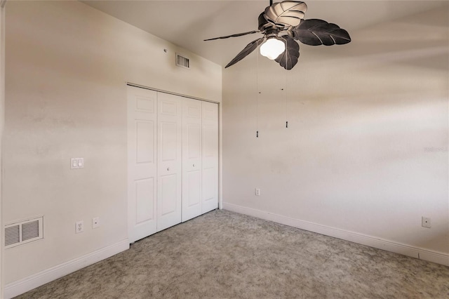 unfurnished bedroom featuring carpet flooring, a closet, and ceiling fan