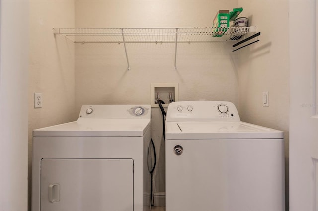 laundry room featuring independent washer and dryer and washer hookup