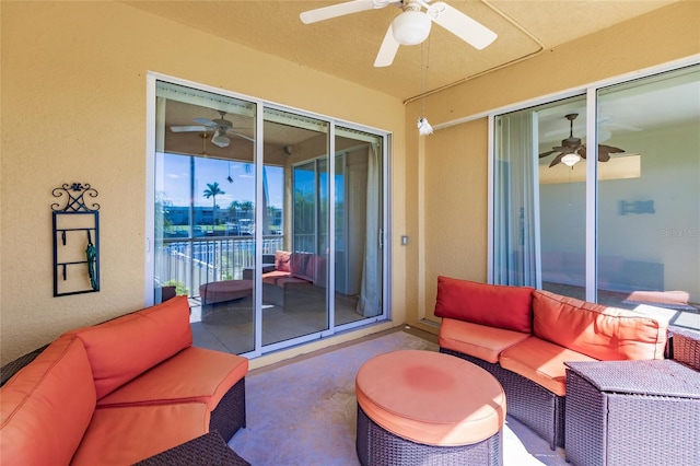 interior space featuring ceiling fan and concrete flooring