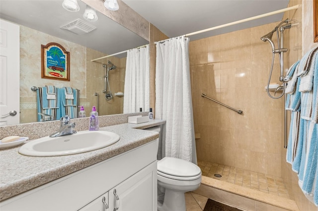 bathroom featuring a shower with curtain, tile flooring, toilet, and vanity