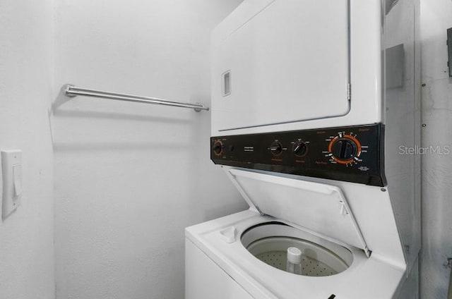 washroom with stacked washer and clothes dryer