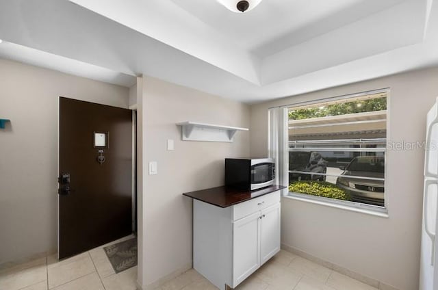 interior space featuring a tray ceiling