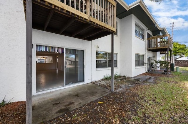 exterior space featuring a balcony and a patio area