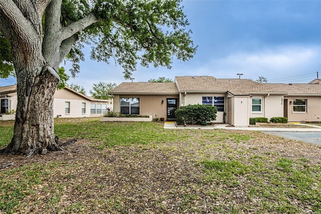 ranch-style home with a front yard