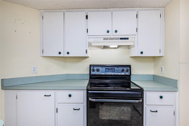 kitchen with a textured ceiling, premium range hood, black electric range, and white cabinets