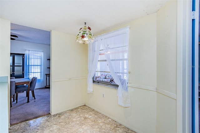 tiled spare room featuring ceiling fan and a textured ceiling