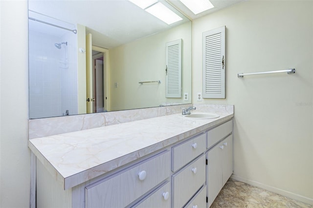 bathroom featuring tile flooring and vanity with extensive cabinet space