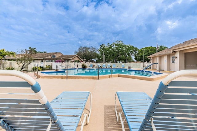 view of swimming pool featuring a patio area