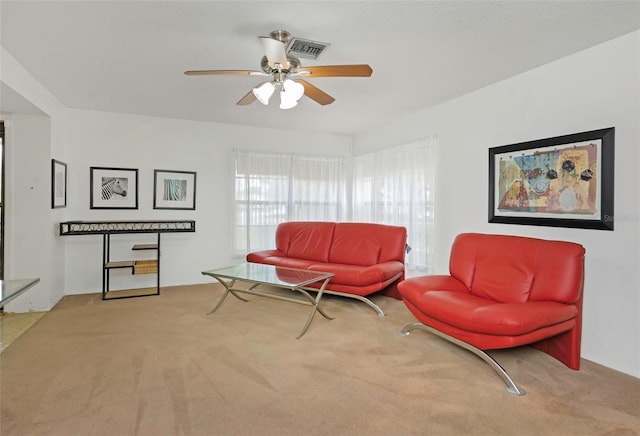 living room featuring ceiling fan and light carpet