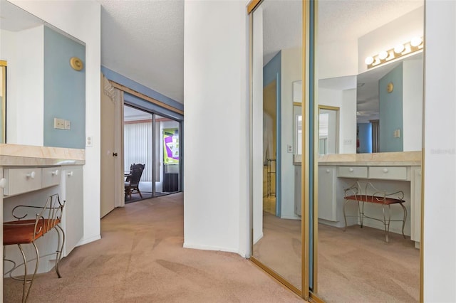 bathroom with vanity and a textured ceiling