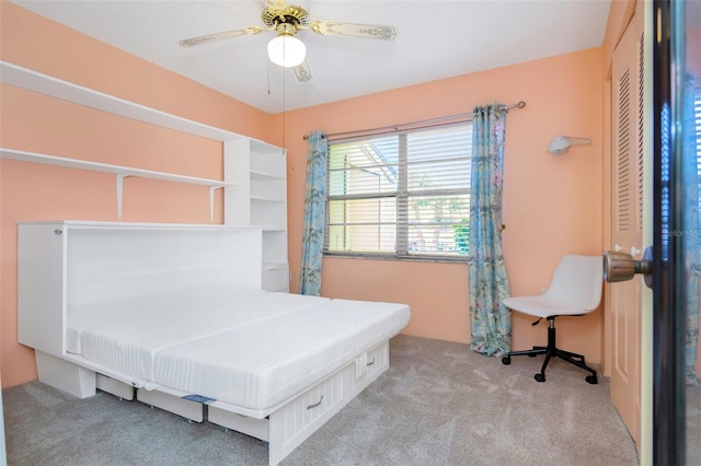 bedroom with ceiling fan and light colored carpet