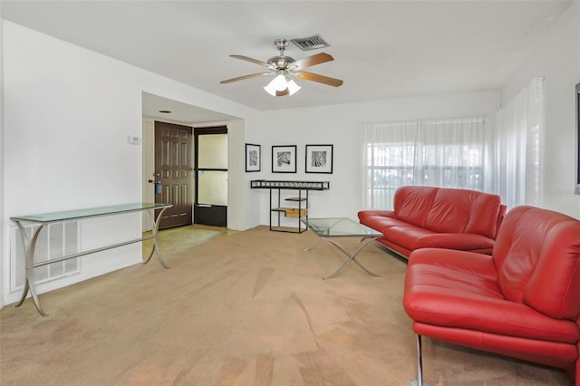 living room with light carpet and ceiling fan