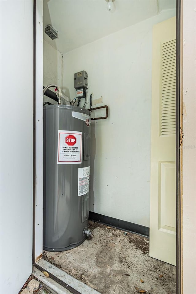 utility room with electric water heater