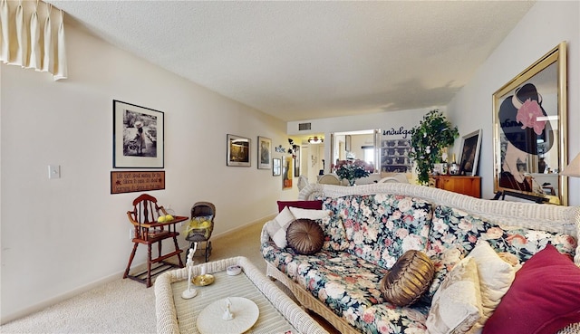 2205 Belleair Rd Unit A13, Clearwater, FL 33764 - carpeted living room featuring a textured ceiling