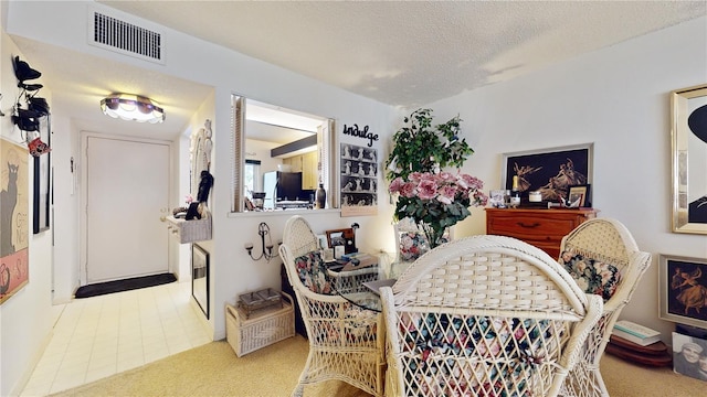 2205 Belleair Rd Unit A13, Clearwater, FL 33764 - carpeted dining room with a textured ceiling