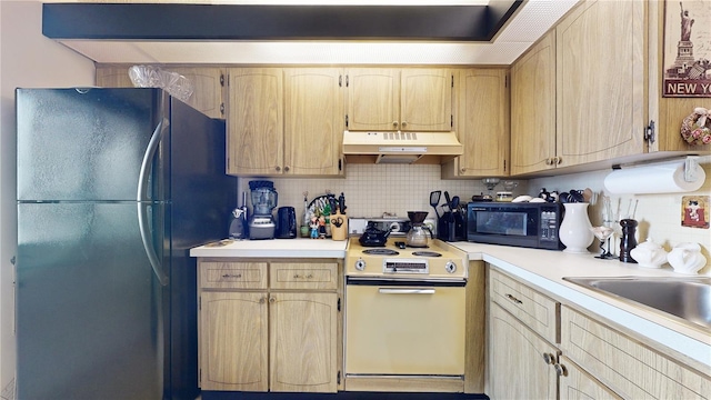 2205 Belleair Rd Unit A13, Clearwater, FL 33764 - kitchen featuring tasteful backsplash, light brown cabinets, black appliances, and sink