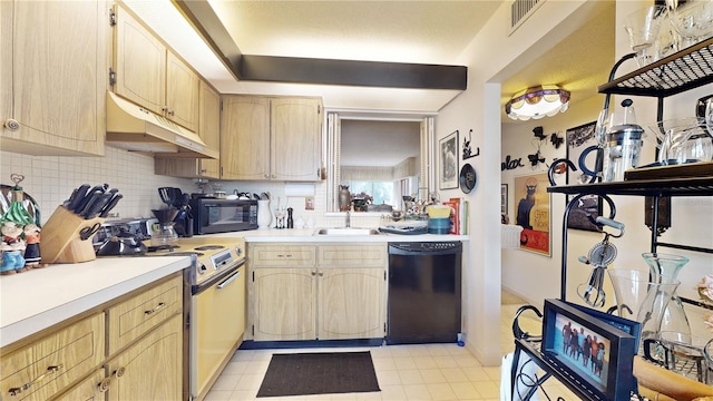 2205 Belleair Rd Unit A13, Clearwater, FL 33764 - kitchen with decorative backsplash, light brown cabinets, sink, and black appliances