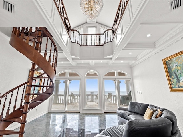 interior space featuring a wealth of natural light, coffered ceiling, and a chandelier