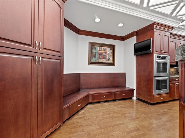 mudroom featuring light hardwood / wood-style floors and crown molding