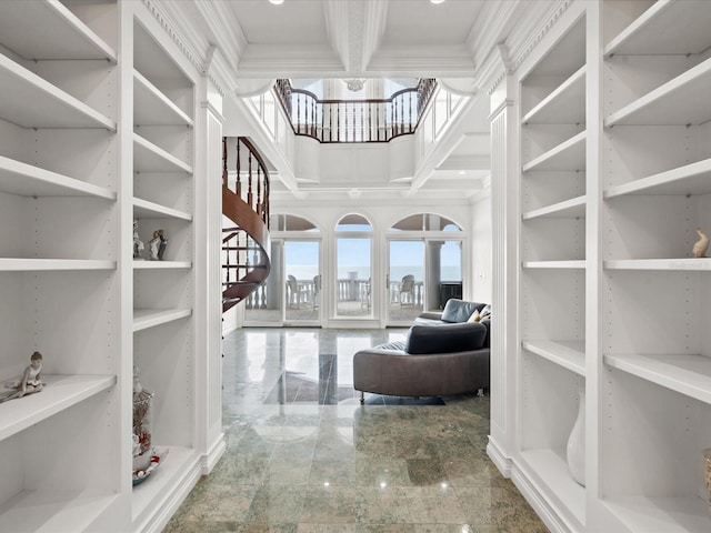 spacious closet featuring coffered ceiling and light tile floors