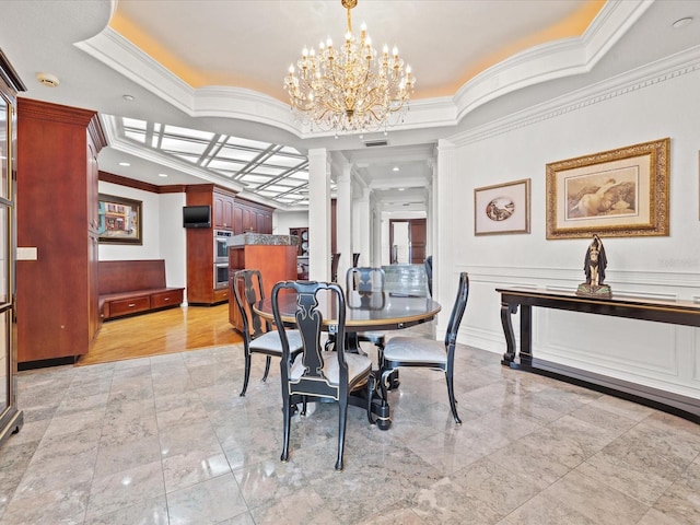 dining space with crown molding, a chandelier, and light tile floors