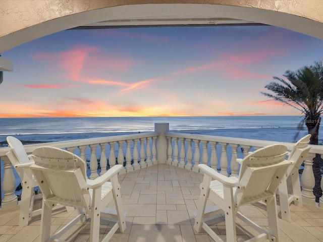 balcony at dusk with a water view